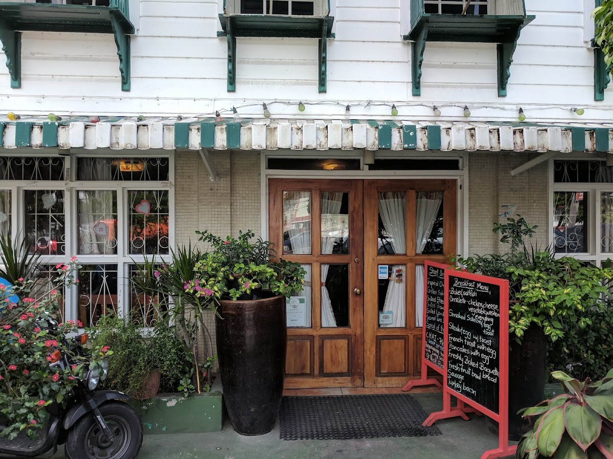 Oasis Cafe entrance with colonial wooden doors