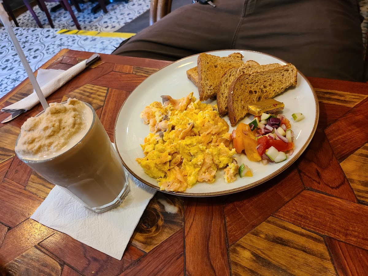 Scrambled eggs with smoked salmon, toast, and latte